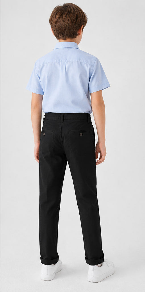 LIUMI Boys Classic Cotton Chino Trousers in Black — back view, worn with a light blue school shirt