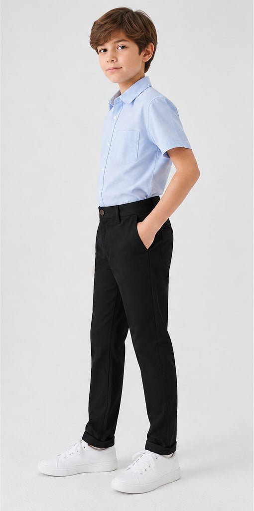 LIUMI Boys Classic Cotton Chino Trousers in Black — side view, worn with a light blue school shirt