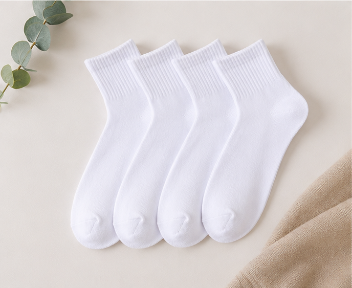 Flat lay of LIUMI Kids white school socks — several pairs shown for styling; each purchase is one pair unless a bundle is selected