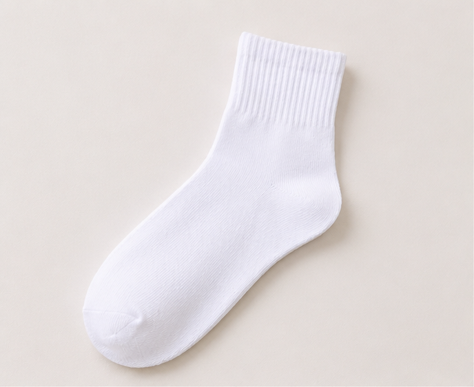 LIUMI Kids Premium White School Socks — a single pair of soft cotton-rich white uniform socks on a cream background
